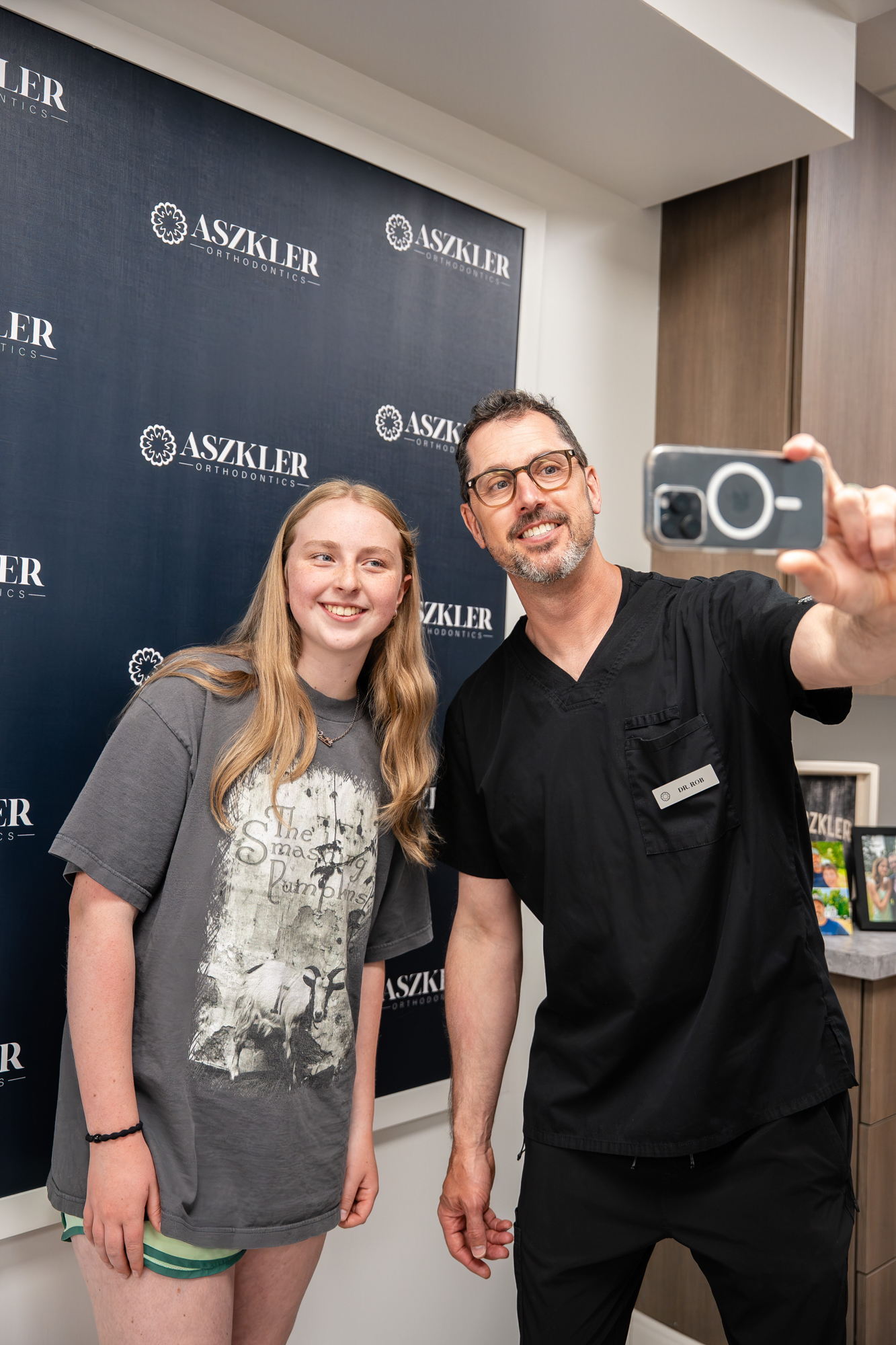 Dr. Askler with a young female patient